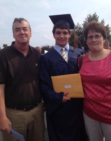 Michael Finch, a baseball player at Owens Community College, with his parents Chales and Wanda Finch at his high school graduation. Wanda died Jan. 17 of cancer. Charles died March 6 of unknown causes. Photo Courtesy Finch Family