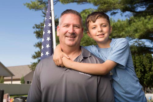 Lt. Col. Frank Dailey, with Myles Eckert, said he’s happy the attention has brought more awareness to gold star families. Toledo Free Press photo by Michael Nemeth