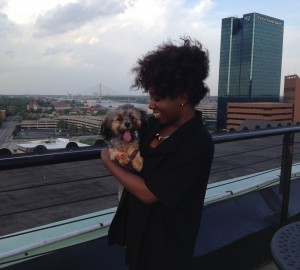 La Salle Apartments resident Jasmine Cogdell with her Yorkshire puppy, Tokyo. Toledo Free Press photo by Sarah Ottney