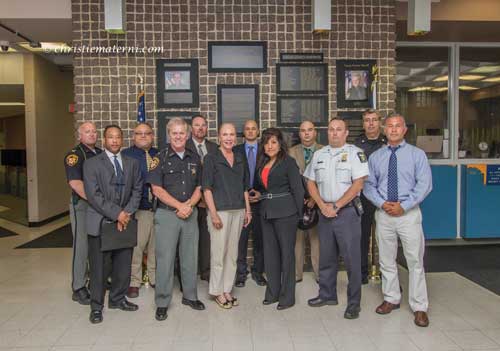 n FIGHTING AN EPIDEMIC: Back Row: William Talbott, Matthew Rizzo, Scott A. Sylak. Damian Worthy, SHERIFF’s Sgt. Joe Gorney and Paul Magdich Front Row: DEPUTY SHERIFF Charles Johnson, LUCAS COUNTY Sheriff John Tharp, Prosecutor Julia Bates, Lt. Andrea LunA, Capt. Michael Troendle and Detective John Szmania. Toledo Free Press photo by Christie Materni/cover illustration by James A. Molnar