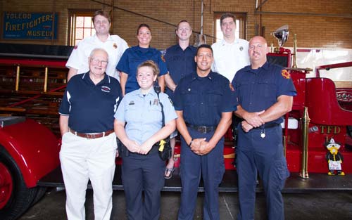 Toledo Fire & Rescue Department's Battalion Chief Mike Nicely (top left), Pvt. Jenny Hill, Pvt. David Ferguson, Lt. Matt Viertlbeck, Retired Asst. Chief Robert Schwanzl (bottom left), Toledo Police Officer Kellie Kenney, Lt. Greg Segura and Pvt. Ross Lewandowski are just a few of the second- and third-generation first responders in Toledo. Toledo Free Press photo by Christie Materni