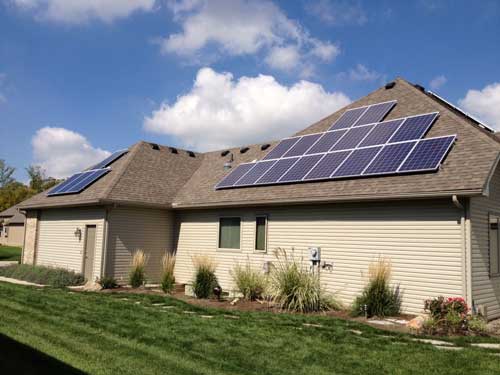 Solar panels were installed on the roof of the Schmitt’s house and garage in Monclova Township that help made it a Net Zero Energy home. Photo courtesy of Decker Homes