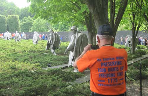 Korean War veteran Theodore LaCourse takes a photo of the Korean War Memorial in Washington, D.C., during an Honor Flight Northwest Ohio trip in June. Photo Courtesy Tim Bellville