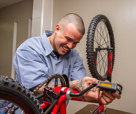 Joshua Faulkner, an inmate at Toledo Correctional Institution, helps assemble bicycles Dec. 5 for Lucas County Children Services and other Northwest Ohio counties. Toledo Free Press Photos by Christie Materni