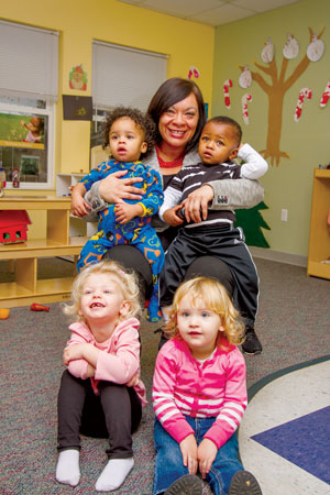 Mom's House Executive Director Christina Rodriguez with, clockwise from top left, Royal, Gabriel, Lorelei and Raelynn. Chicks for Charity recently chose Mom's House as its 2015-16 charity recipient. Toledo Free Press photo by Christie Materni