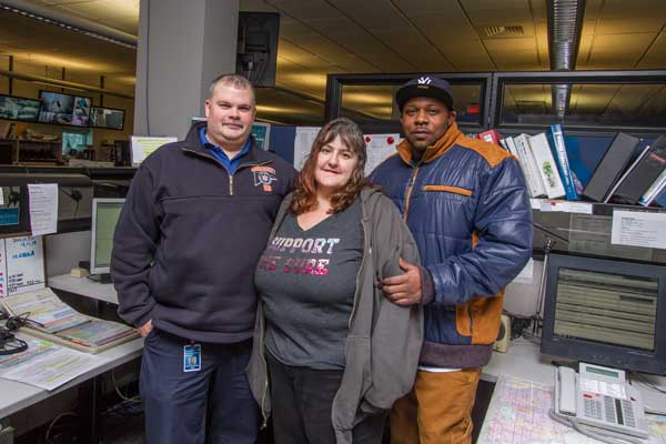 Lucas County EMS Lead Dispatcher Brian Dempsey, left, talked Evelyn Johnson and Andra Crisp through Assisting Toledo Mayor D. Michael Collins after his cardiac arrest and accident Feb. 1, including performing CPR until paramedics arrived. Neither had formal CPR training and neither realized at the time that the man they were helping was mayor collins. The three met for the first time Feb. 4 at the Lucas County EMS building. Toledo Free Press photo by Christie Materni