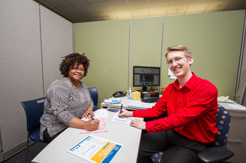 n VOLUNTEER Jacob merkle, right, helps pamela redd prepare her taxes at the United Way of Greater Toledo. TOLEDO FREE PRESS PHOTO BY CHRISTIE MATERNI