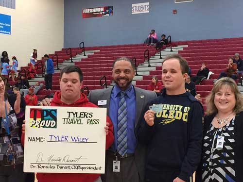 Tyler Wiley, left, with Toledo Public Schools Superintendent Romules Durant and BJ Axe. Wiley and Axe are the first two recipients of Tyler’s Travel Pass. According to the Lucas County Board of Developmental Disabilities, about 10 people have applied for the pass so far. Photo Courtesy Toledo Public Schools
